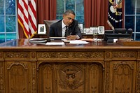 President Barack Obama talks with Texas Gov. Rick Perry to express his concern for citizens of that state impacted by the unprecedented fires, during a phone call in the Oval Office, Sept. 7, 2011.