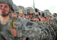 U.S. Army Sgt. 1st Class Bakari Brown, center, with the 82nd Airborne Division, looks on during sustained airborne training for Operation Toy Drop (OTD) at Pope Field, N.C., Dec. 09, 2011.