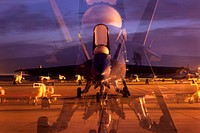 Double Vision. A service member with the Blue Angels Navy Flight Demonstration Squadron goes over the morning turns to ensure the F/A-18 Hornet is ready for the day’s flight. Original public domain image from Flickr