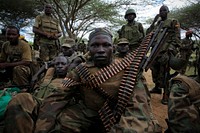Ugandan soldiers serving with the African Union Mission in Somalia (AMISOM), listens while Contingent Commander for Uganda, Brigadier Paul Lokech (not seen) briefs members of 09 Battalion before an advance on the town of Afgoye to the west of the Somali capital Mogadishu.