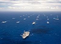 Ships and submarines participating in Rim of the Pacific (RIMPAC) exercise 2012 sail in formation in the waters around the Hawaiian Islands July 27, 2012.