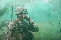 U.S. Marine Corps Staff Sgt. Bryan Robbins, a platoon sergeant with the 3rd Platoon, Golf Company, Battalion Landing Team, 2nd Battalion, 1st Marine Regiment, 31st Marine Expeditionary Unit, calls for mortar support during a live-fire exercise in Shoalwater Bay, Queensland, Australia, July 13, 2012, during exercise Hamel 2012.