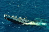 The former combat stores ships USNS Concord (T-AFS 5) sinks in the Pacific Ocean after being used as a target vessel by the Royal Canadian Navy submarine HMCS Victoria (SSK 876) during a sink exercise July 17, 2012, as part of Rim of the Pacific (RIMPAC) 2012.