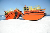 Arktos Developments personnel drive an amphibious craft onto an ice floe during a demonstration for the U.S. Coast Guard, 10 miles off the coast of Barrow, Alaska, Aug. 13, 2012.