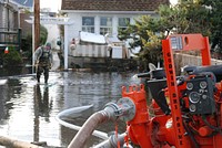 U.S. Service members supporting the U.S. Army Corps of Engineers and the Federal Emergency Management Agency's mission to allow access to flooded homes, pump up to a million gallons of water per day in Breezy Point, Queens, N.Y., Dec. 4, 2012, in the wake of Hurricane Sandy.