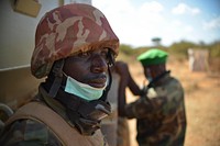 Soldiers stationed at frontline military bases in Lower Shabelle, Somalia, listen to Lieutenant General Katumba, Commander of the Land Forces of the Ugandan People's Defense Force (UPDF), who visited the soldiers on January 9, 2013.