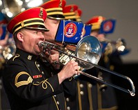 A U.S. Army Band trombone player with the "Pershing's Own" plays the national anthem at the armed forces farewell tribute in honor of Secretary of Defense Leon E. Panetta at Joint Base Myer-Henderson Hall, Va., Feb. 8, 2013.