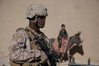 U.S. Marine Corps Gunnery Sgt. Donnie Bridges, the company gunnery sergeant with Echo Company, 2nd Battalion, 7th Marine Regiment, Regimental Combat Team 7, provides security at an Afghan National Civil Order Police checkpoint in the Kajaki district, Helmand province, Afghanistan, Feb. 8, 2013.