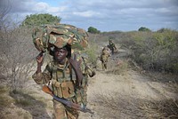 Ugandan soldiers, operating under the African Union Mission in Somalia (AMISOM), advance towards Buur-Hakba from their former position in the town of Leego alongside members of the Somali National Army (SNA) on February 24, 2013.