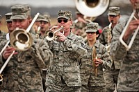 The U.S. Air Force Band of Mid-America marches outside as Marine Corps veteran Reggie Geggie, not pictured, guest of honor and family arrive to the band hall at Scott Air Force Base, Ill., Feb. 25, 2013.