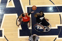 Anthony Pone, right, with the U.S. Army wheelchair basketball team, takes the tipoff from Jorge Salazar, with the Marine Corps team, during the 2013 Warrior Games in Colorado Springs, Colo., May 15, 2013.