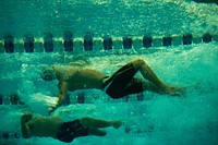 Swimmers compete in the men’s 50-meter backstroke at the 2013 Warrior Games in Colorado Springs, Colo., May 16, 2013.