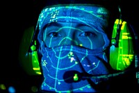 A U.S. Sailor portrays combat readiness in a posed photo aboard the amphibious transport dock ship USS San Antonio (LPD 17) during International Mine Countermeasures Exercise (IMCMEX) 13 in Bahrain May 19, 2013.