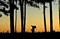 A U.S. Soldier assigned to the 2nd Brigade Combat Team, 82nd Airborne Division rests after completing a road march to qualify for an Expert Infantryman Badge at Fort Bragg, N.C., June 14, 2013.