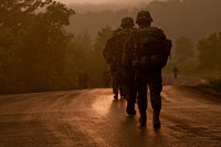 U.S. Soldiers walk toward the rising sun during the 10-kilometer road march at the 2013 Army Reserve Best Warrior competition at Fort McCoy, Wis., June 26, 2013.