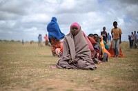 Female IDPs sit waiting at a food distribution center in Afgoye, Somalia, on August 4th.
