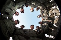 U.S. Soldiers with the 2nd Platoon, Bravo Company, 1st Battalion, 294th Infantry Regiment, Guam Army National Guard gather to say a prayer before a mission at Main Operating Base Lashkar Gah, Helmand province, Afghanistan, July 19, 2013.