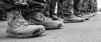 Afghan and coalition forces stand at parade rest as the names of fallen comrades are read during a memorial ceremony at Bagram Airfield in Parwan province, Afghanistan, Sept. 12, 2013.