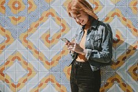 Woman using her phone, white tone