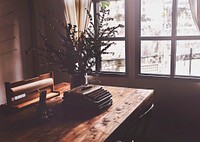 Typewriter on wooden table, warm tone