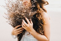 Autumn desktop wallpaper background, woman with dried flower bouquet, warm tone