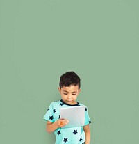 Little boy studio isolated with tablet