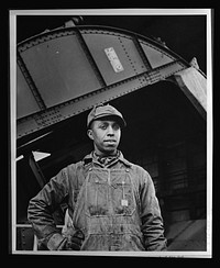 African Americans speed war work for Tennessee Valley Authority. Earl M. Qualls, car dumper operator at Watts Bar, is job steward of the Hod Carriers' local union on TVAuthority, and is active in combatting absenteeism and in furthering war bond Red Cross drives. Sourced from the Library of Congress.