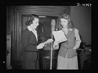 "You Can't Do Business With Hitler." Ilona Killian (left) and Virginia Moore are rehearsing for "You Can't Do Business With Hitler" radio show, written and produced by the radio section of the Office of War Information (OWI). This series of programs is broadcast by 790 stations throughout the country. Sourced from the Library of Congress.