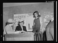 Sugar rationing. Mrs. Henry Wallace, wife of the Vice President, learns how millions of American householders will register for their sugar rationing cards from May 4th through May 7th. She's getting the information from a teacher and pupil at Western High School, Washington, D.C.. Sourced from the Library of Congress.