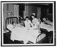 Biggest and most immediately useful role for women in the civilian defense program is that of nurse's aide. Training of 100,000 volunteers as nurse's aides is designed by the American Red Cross, working with the Office of Civilian Defense, to relieve the acute shortage of nursing service threatening civilian hospitals and health agencies because. Sourced from the Library of Congress.