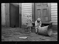 [Untitled photo, possibly related to: Poor children playing on sidewalk, Georgetown, Washington, D.C.]. Sourced from the Library of Congress.