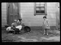 [Untitled photo, possibly related to: Poor children playing on sidewalk, Georgetown, Washington, D.C.]. Sourced from the Library of Congress.