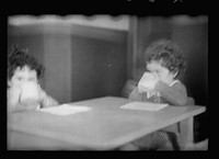[Untitled photo, possibly related to: Radburn, New Jersey, a privately financed model town which furnished some of the ideas for the United States Suburban Resettlement Administration's Greenbelt towns. Young artist at the community kindergarten]. Sourced from the Library of Congress.
