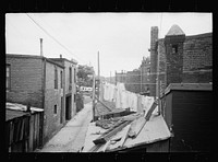 [Untitled photo, possibly related to: Alleyway inhabited by black and white near the Capitol, Washington, D.C.]. Sourced from the Library of Congress.