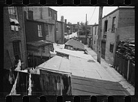 [Untitled photo, possibly related to: Typical slum area. Note dome of Capitol, Washington, D.C.]. Sourced from the Library of Congress.