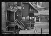 [Untitled photo, possibly related to: Typical slum area. Note dome of Capitol, Washington, D.C.]. Sourced from the Library of Congress.