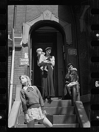 Front of a typical house offering furnished rooms for rent, District of Columbia. Sourced from the Library of Congress.