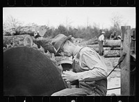 [Untitled photo, possibly related to: Splitting shingles with froe and maul on Coalins Project area farm, in western Kentucky]. Sourced from the Library of Congress.