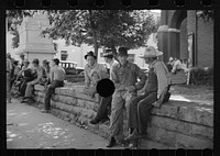 [Untitled photo, possibly related to: Loafers' wall, at courthouse, Batesville, Arkansas. Here from sun up until well into the night these fellows, young and old, "set". Once a few years ago a political situation was created when an attempt was made to remove the wall. It stays. When asked what they do there all day, one old fellow replied: "W-all we all just a 'set'; sometimes a few of 'em get up and move about to 'tother side when the sun gets too strong, the rest just 'sets'."]. Sourced from the Library of Congress.