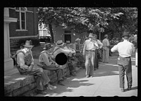 [Untitled photo, possibly related to: Loafers' wall, at courthouse, Batesville, Arkansas. Here from sun up until well into the night these fellows, young and old, "set". Once a few years ago a political situation was created when an attempt was made to remove the wall. It stays. When asked what they do there all day, one old fellow replied: "W-all we all just a 'set'; sometimes a few of 'em get up and move about to 'tother side when the sun gets too strong, the rest just 'sets'."]. Sourced from the Library of Congress.