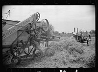 [Untitled photo, possibly related to: Clover farmer on seed threshing machine, St. Charles Parish, Louisiana]. Sourced from the Library of Congress.