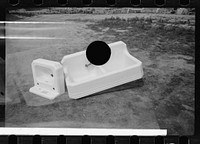 [Untitled photo, possibly related to: Greenbelt, Maryland. A model community planned by the Suburban Resettlement Division of the U.S. Resettlement Administration. Plumbing fixtures awaiting installation]. Sourced from the Library of Congress.