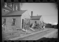 Alley-like street off State Street near Granite Street, Amoskeag, Manchester, New Hampshire. Sourced from the Library of Congress.