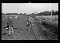 [Untitled photo, possibly related to: Farm children on the way to school with lunch pails, Nebraska]. Sourced from the Library of Congress.