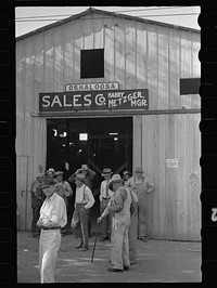 [Untitled photo, possibly related to: Farmers waiting for the auction to begin. Oskaloosa, Kansas]. Sourced from the Library of Congress.
