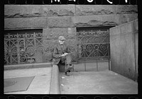 Man sitting on the post office, Omaha, Nebraska. Sourced from the Library of Congress.