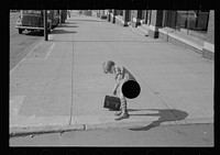[Untitled photo, possibly related to: Girl carrying her father's lunch pail, South Omaha, Nebraska]. Sourced from the Library of Congress.
