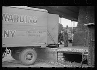 [Untitled photo, possibly related to: Family of trucker waiting while truck is being loaded, Minneapolis, Minnesota]. Sourced from the Library of Congress.