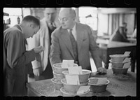 [Untitled photo, possibly related to: Buyer at open grain market, Minneaplis Grain Exchange, Minnesota]. Sourced from the Library of Congress.