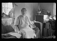[Untitled photo, possibly related to: Mrs. Howard, who lives with her daughter in one-room cabin they built themselves, Aitkin County, Minnesota]. Sourced from the Library of Congress.